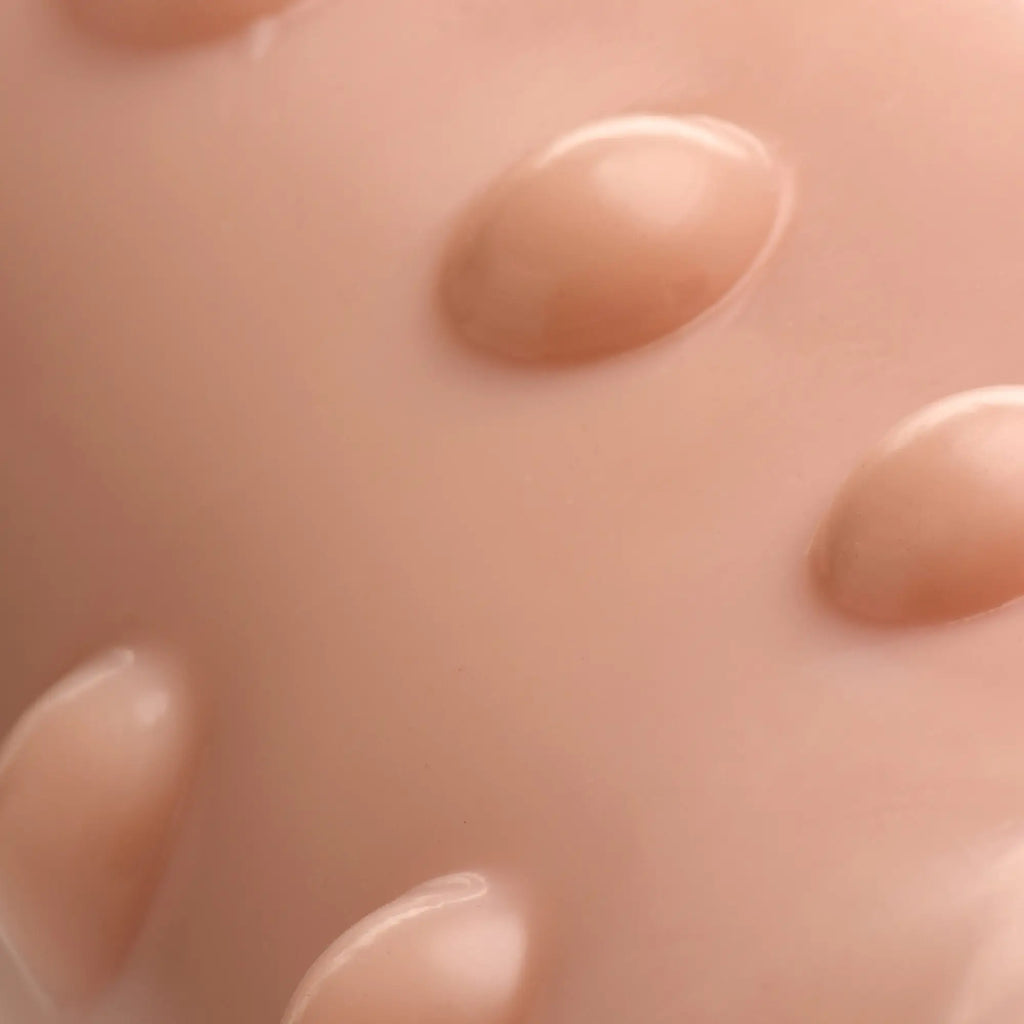 Close-up of the smooth, flesh-toned Size Matters 7 Inch Penis Extension, showing its textured, raised surface bumps.