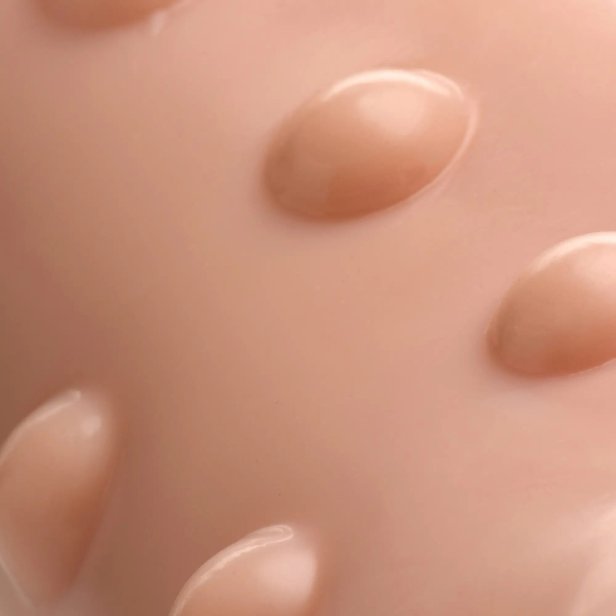 Close-up of the smooth, flesh-toned Size Matters 7 Inch Penis Extension, showing its textured, raised surface bumps.