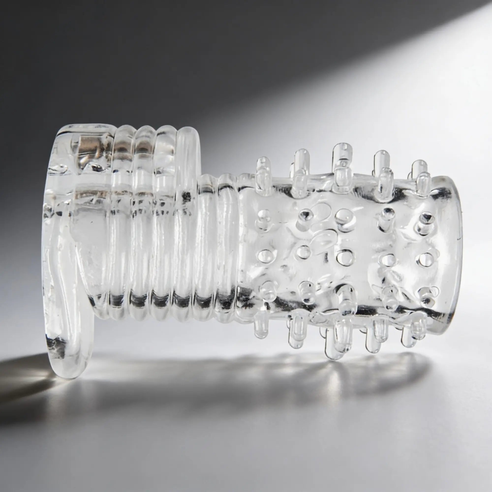 Size Matters Clear Sensations vibrating erection sleeve: a transparent, ribbed, and studded silicone textured sleeve.