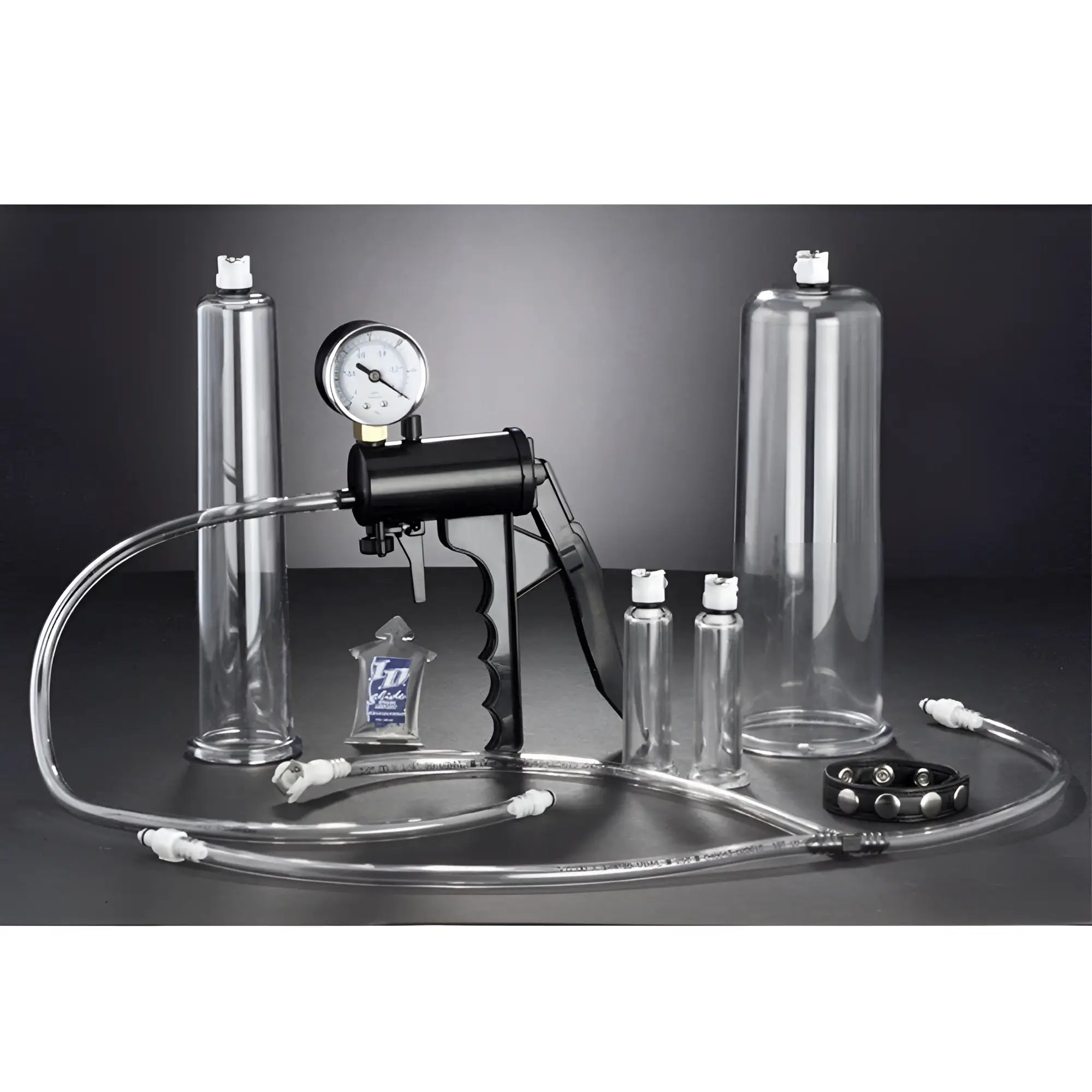 Size Matters Deluxe Men's Pumping Set with black hand pump, pressure gauge, clear cylinders, tubing, and accessories.