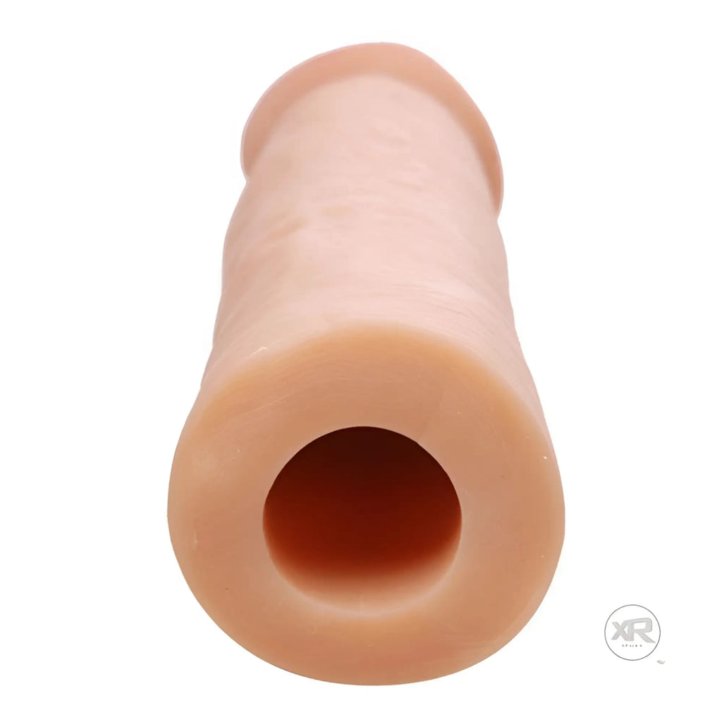 Size Matters Mega Enlarger: A nude-colored, cylindrical silicone penis enhancement sleeve with a textured design.