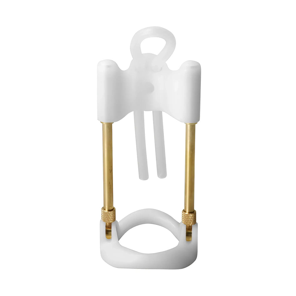 Size Matters penis enlarger featuring a white frame with brass rods and a silicone ring against a white background.
