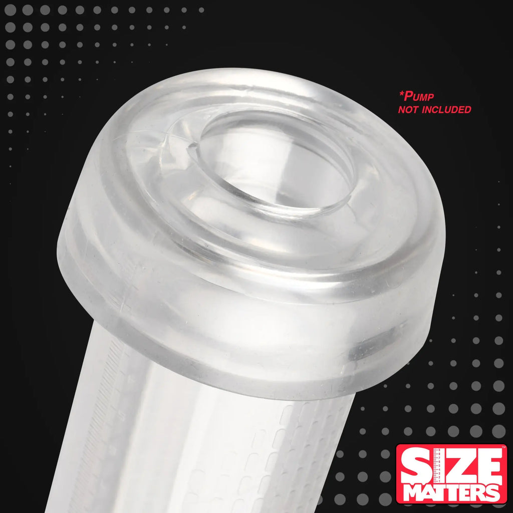Clear, cylindrical Size Matters Universal Pump Sleeve with a thick, flared opening against a black dotted background.