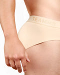Beige skin brief amazing underwear with subtle gold logo on waistband designed for comfortable everyday wear