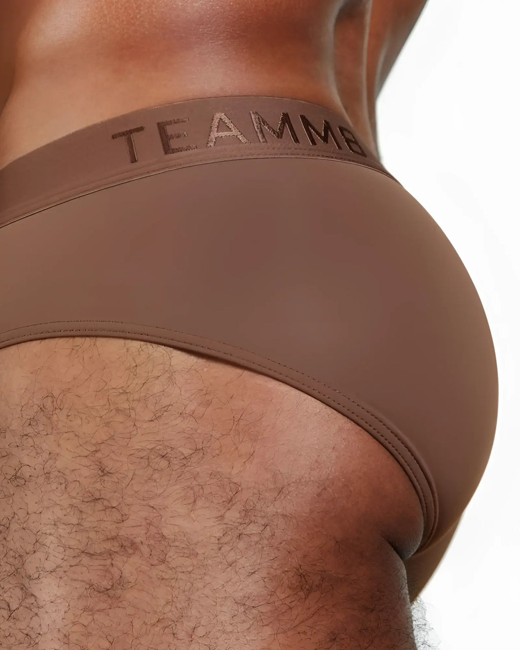 Brown skin brief with subtle textured waistband offering comfortable and stylish underwear fit