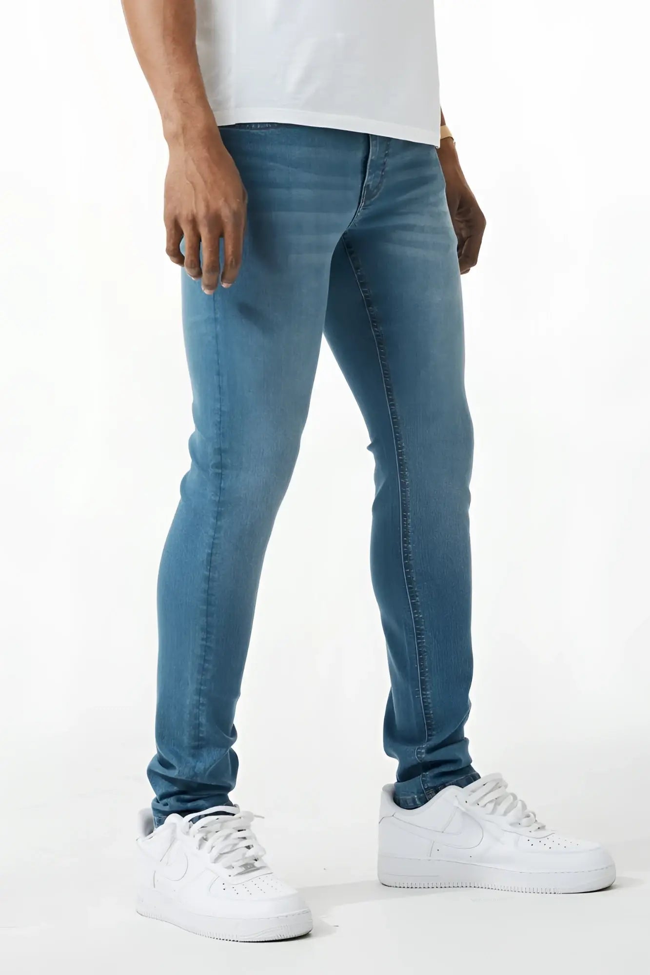 Blue skinny fit denim jeans with slim fit cut five-pocket design and subtle fading made of denim material