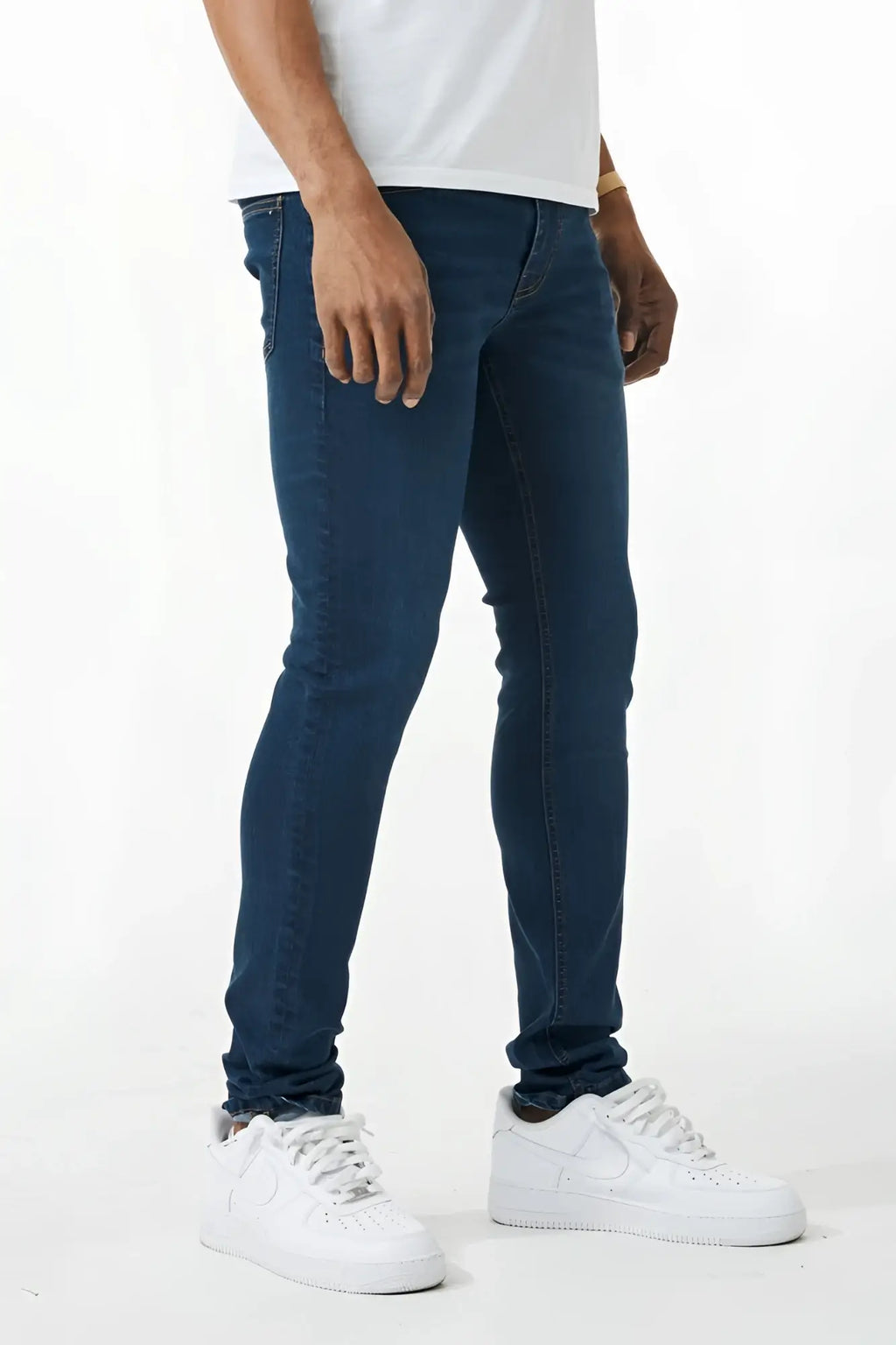 Dark blue skinny fit denim jeans with slim fit, classic five-pocket design, and subtle thigh fading