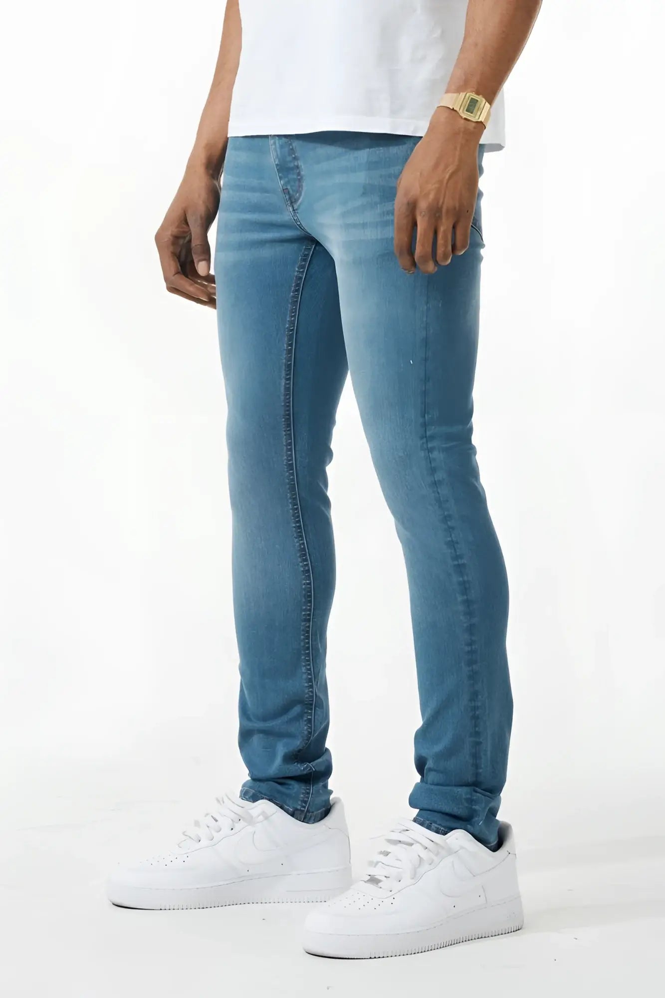 Light-wash blue skinny fit denim jeans with classic five-pocket design and subtle fading along the thighs