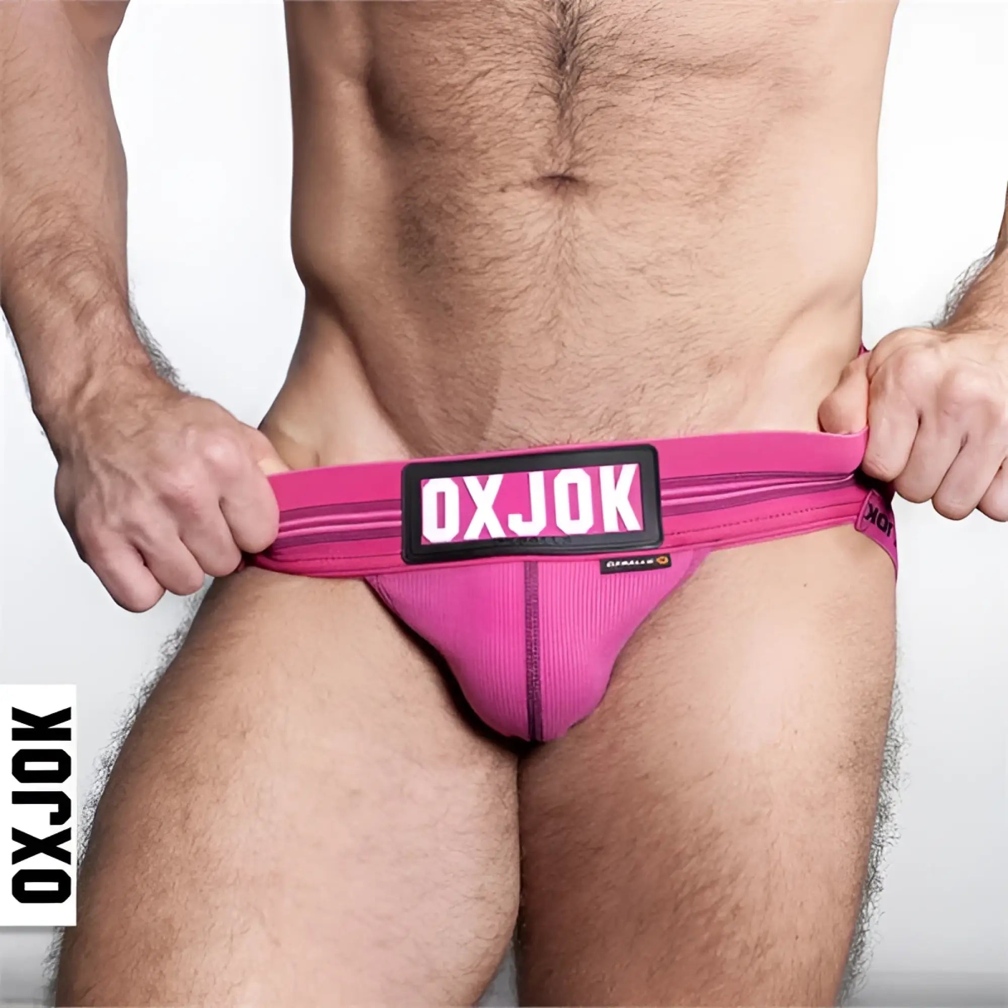 Bright pink slingjock jockstrap briefs with ribbed texture and black oxjok logo patch front view