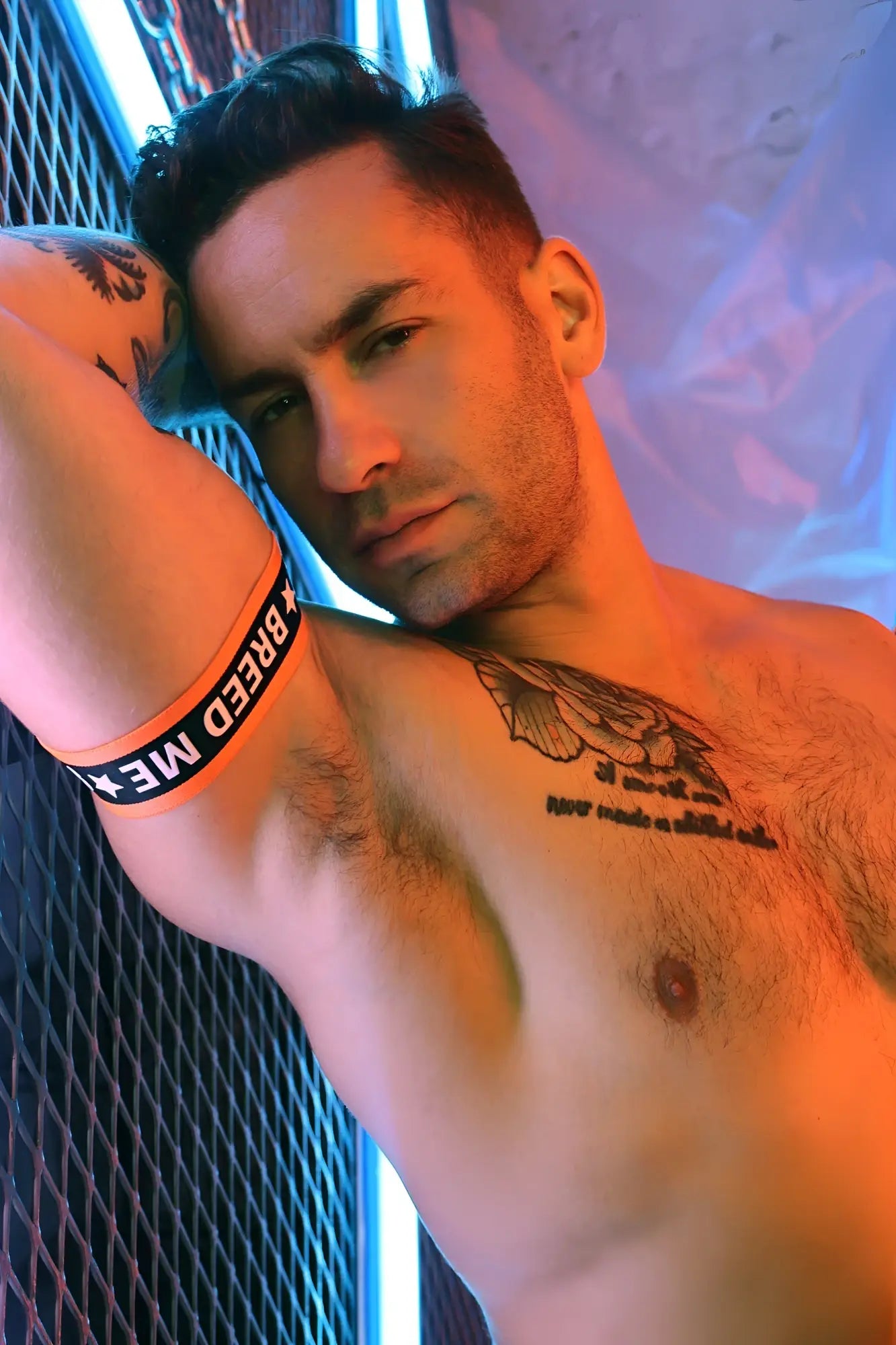 Snax armbands orange wristband with black breed me text and white star symbols for bold statement wear