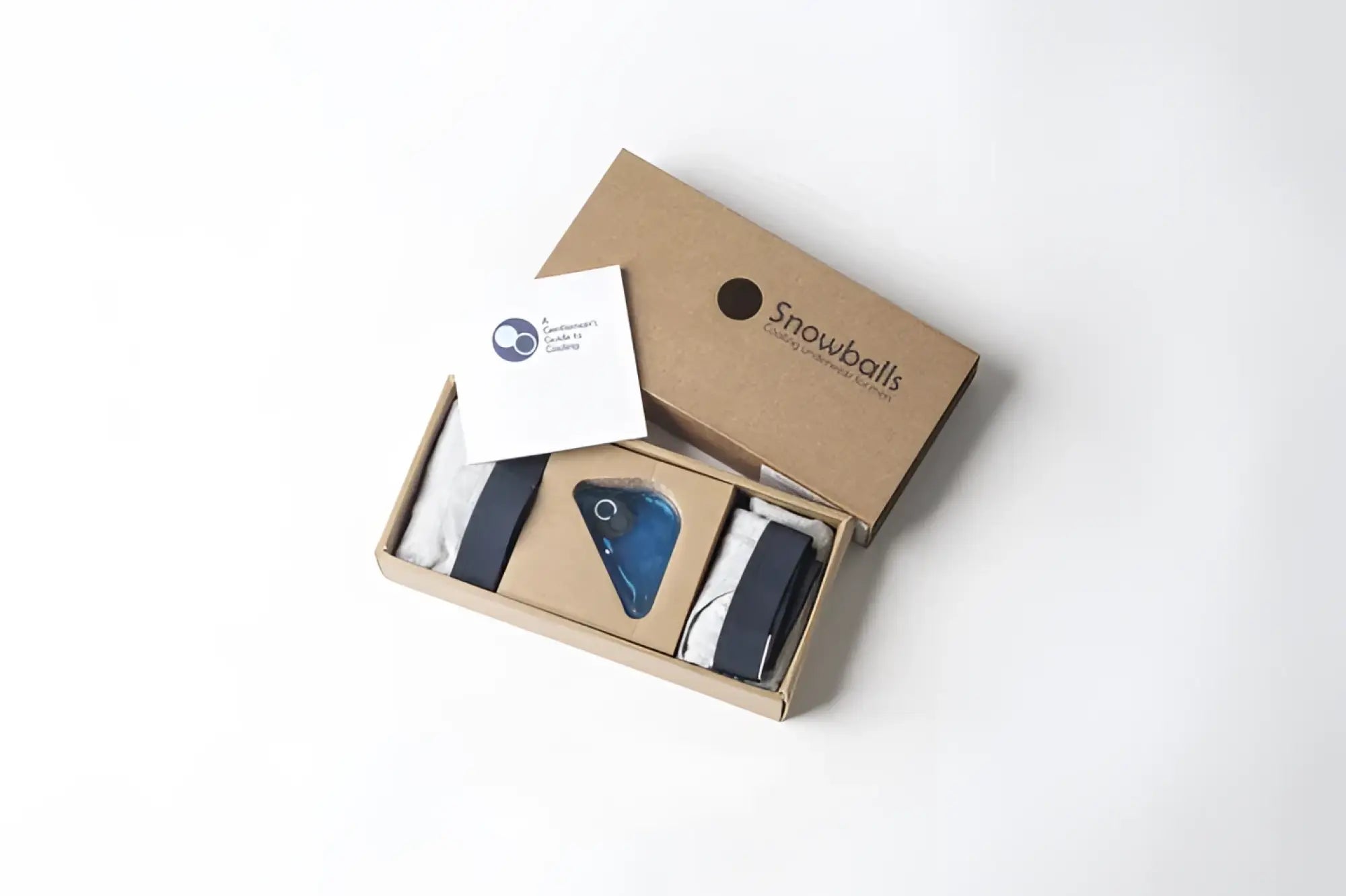 A sleek minimalist brown cardboard box made of eco-friendly material with snowballs brand logo for underwear packaging