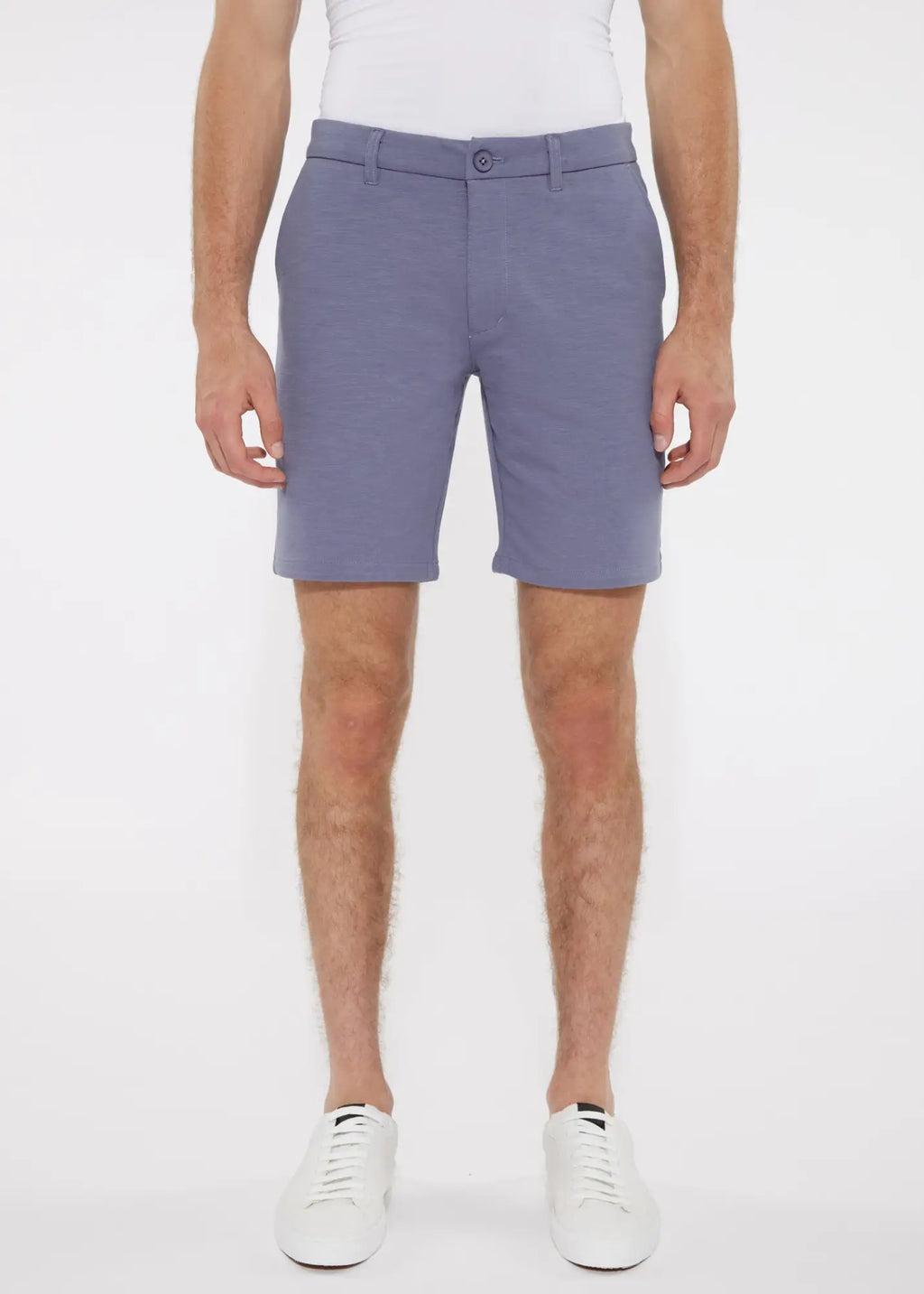 A pair of men’s solid light blue stretch knit tailored shorts with belt loops and single button closure