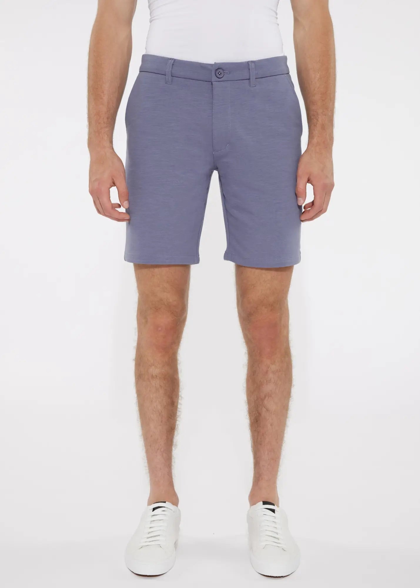 A pair of men’s solid light blue stretch knit tailored shorts with belt loops and single button closure
