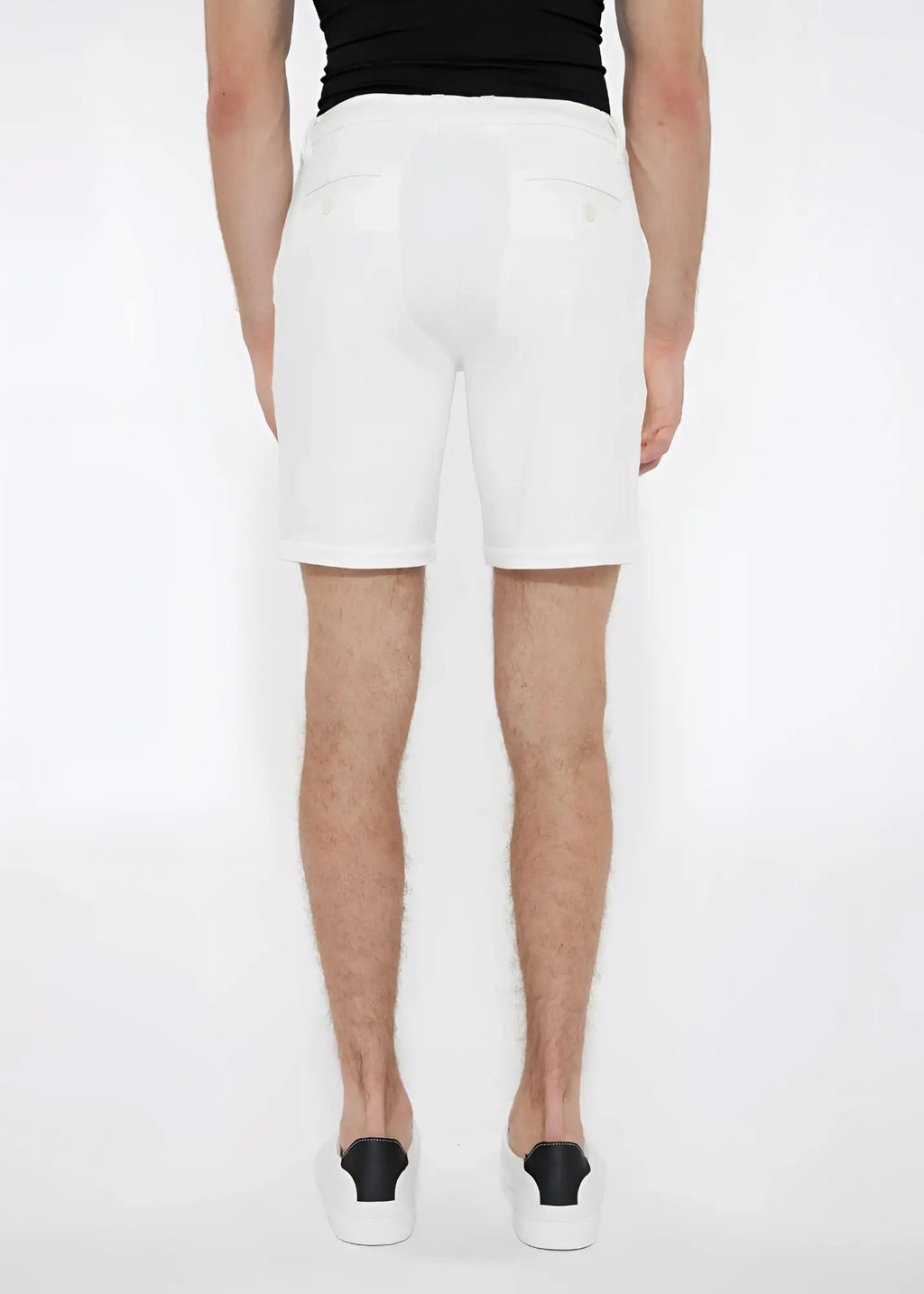 White solid stretch knit shorts with a clean tailored fit and subtle back pockets shown from the back side