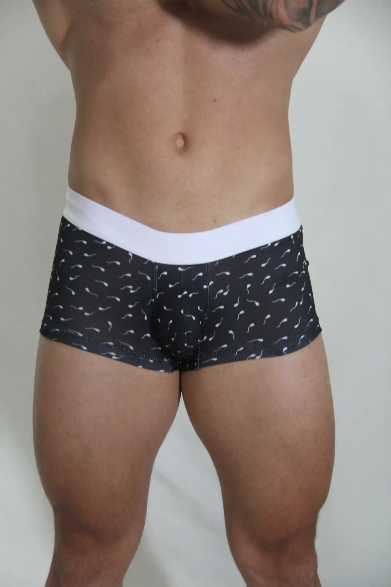 Black boxer briefs sperm trunk with a white elastic waistband and light-colored mustache pattern