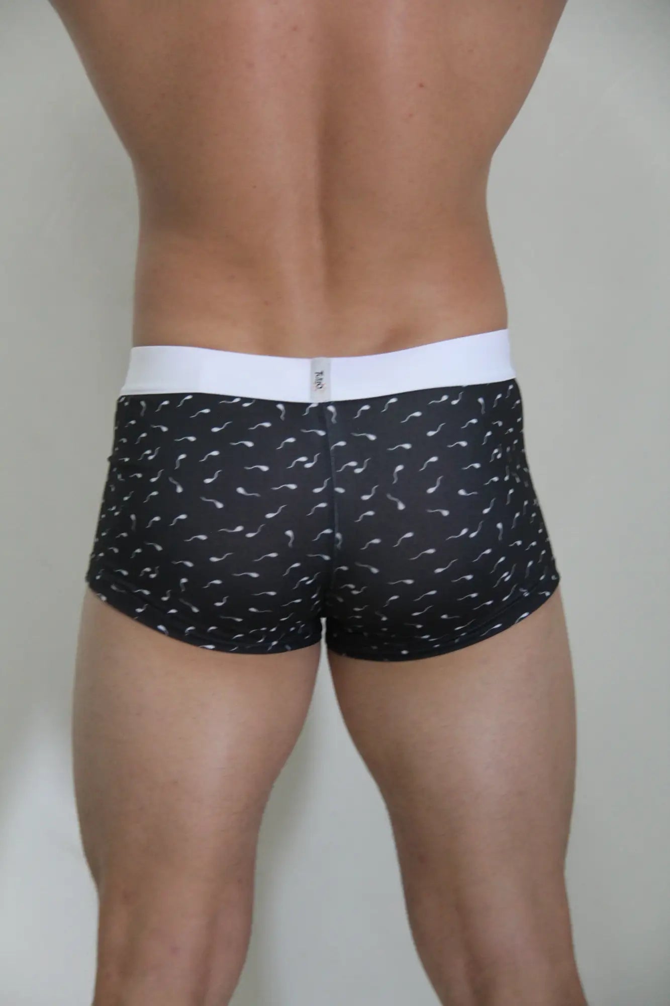 Black sperm trunk boxer briefs with white waistband and stylized sperm pattern perfect for everyday wear