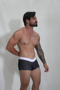 Black sperm trunk briefs with white waistband and small light-colored bird patterns for everyday wear