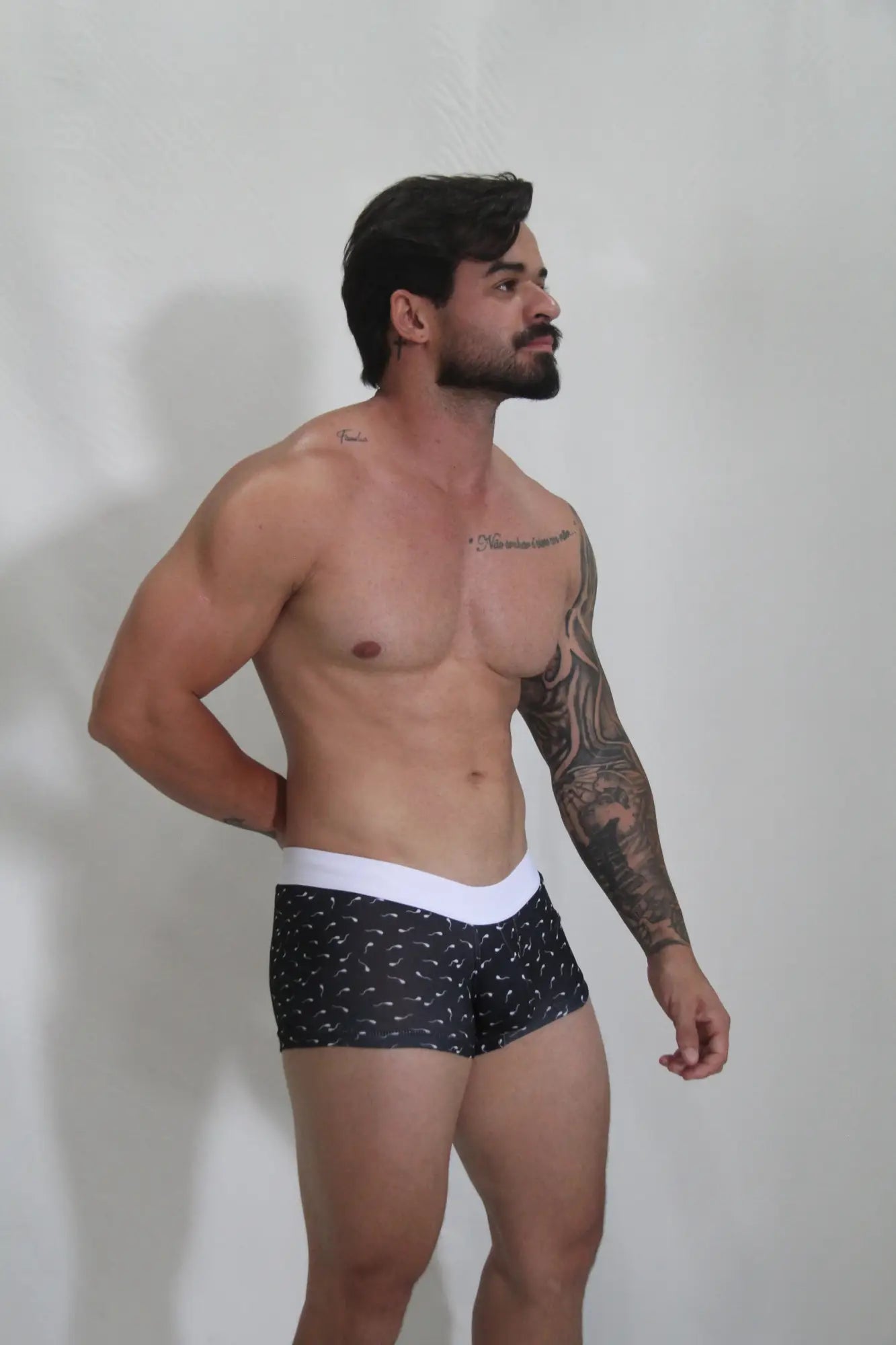 Black sperm trunk briefs with white waistband and small light-colored bird patterns for everyday wear