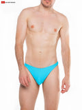 Bright turquoise splash c-ring thong swim trunks made of go softwear fabric showing front view