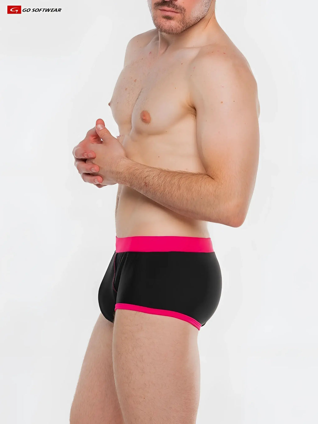 Black splash full-cut brief swim with vibrant pink waistband and trim featuring go softwear logo