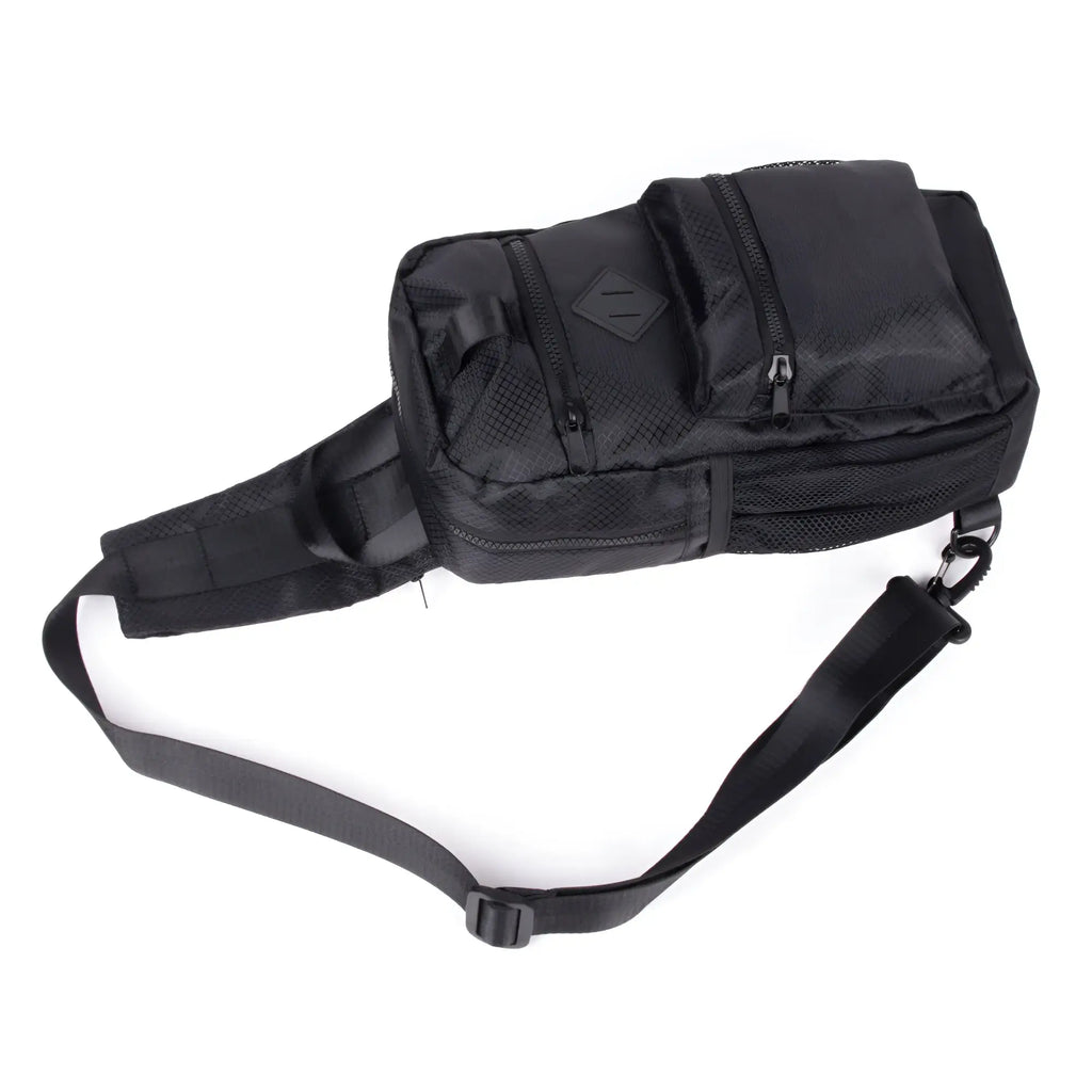 Black sport crossbody sling bag featuring tactical mesh panels and multiple zippered compartments for secure storage