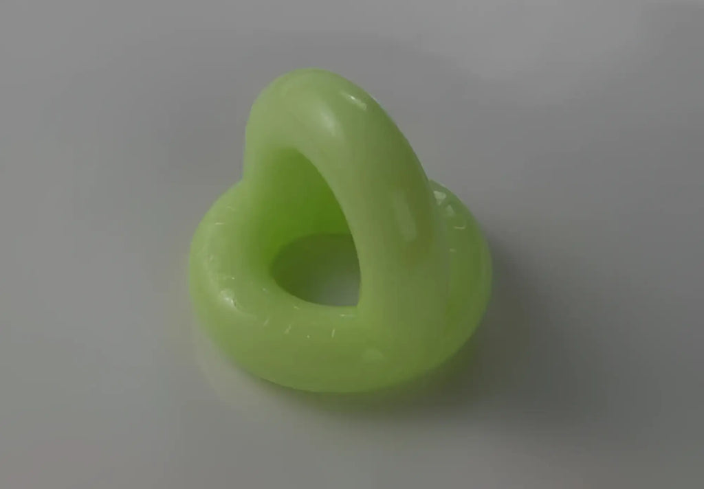 Lime-green sport f-cker tpr c ring glow size one size with heart-shaped cutout made of silicone