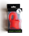 Red silicone sport fucker baller ring inside black packaging showing the front side of the product