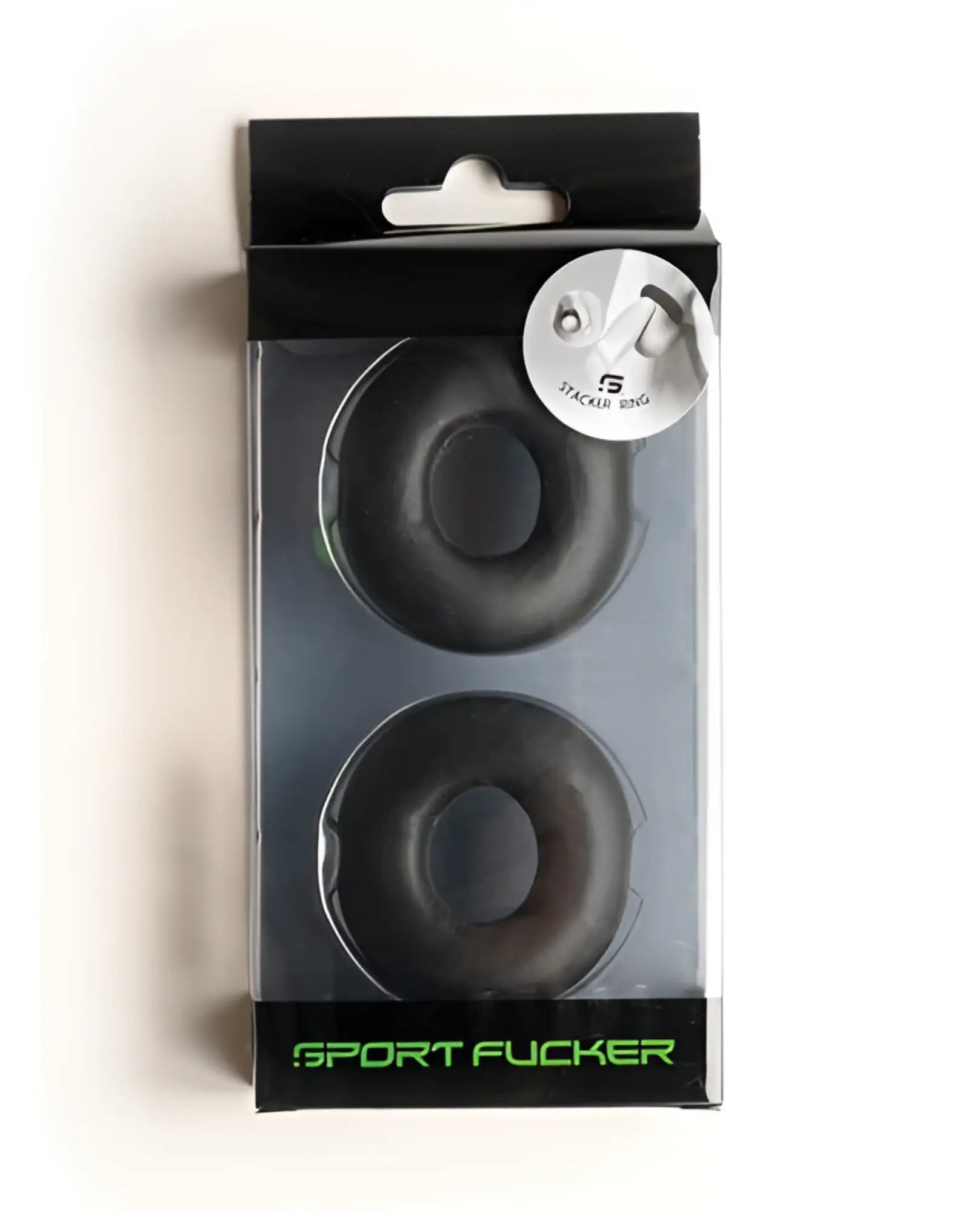 Black rubber sport fucker stacker rings in clear plastic package with green branding for sports grip use