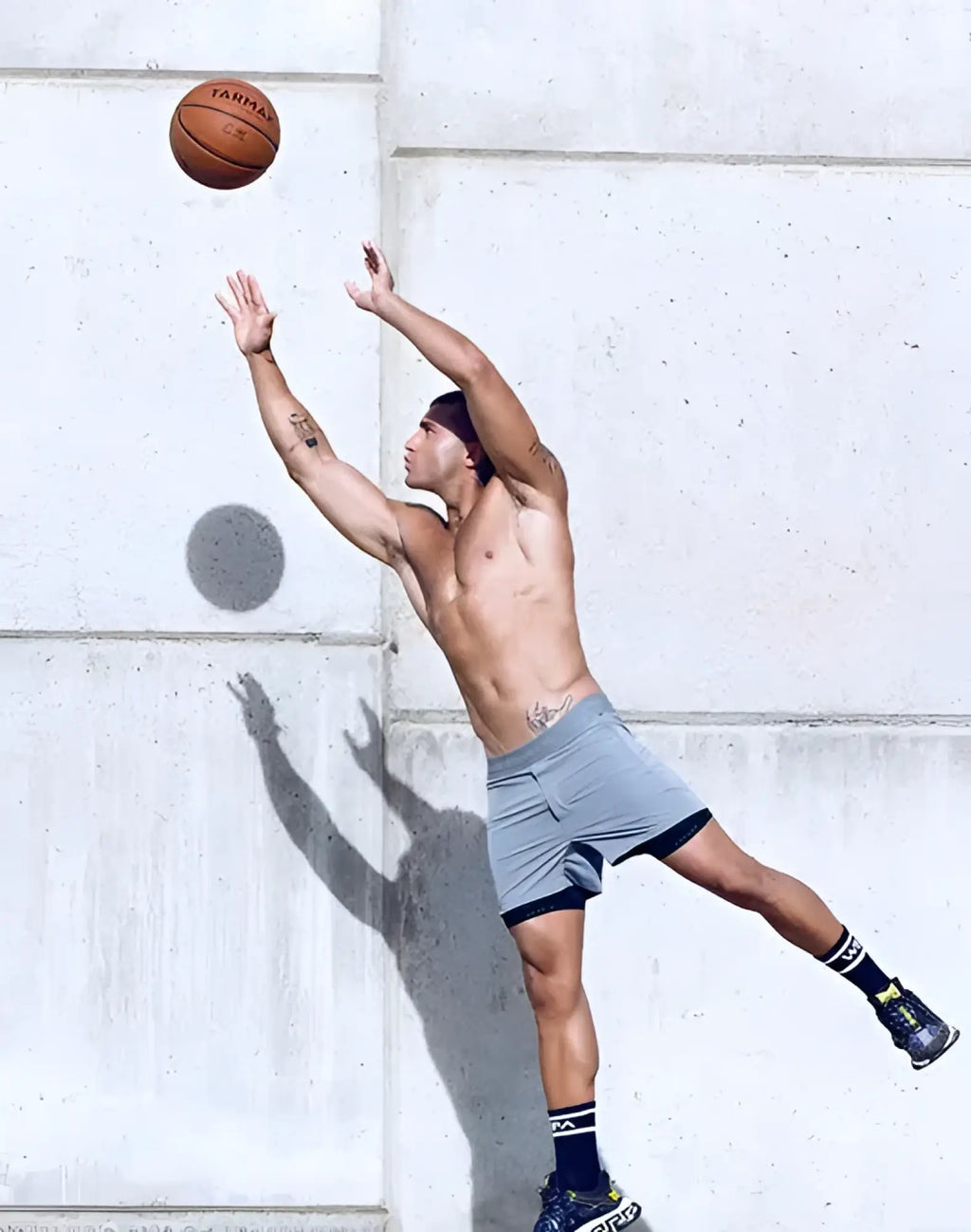 Orange leather basketball with tarma branding featured in the spr flex short product image