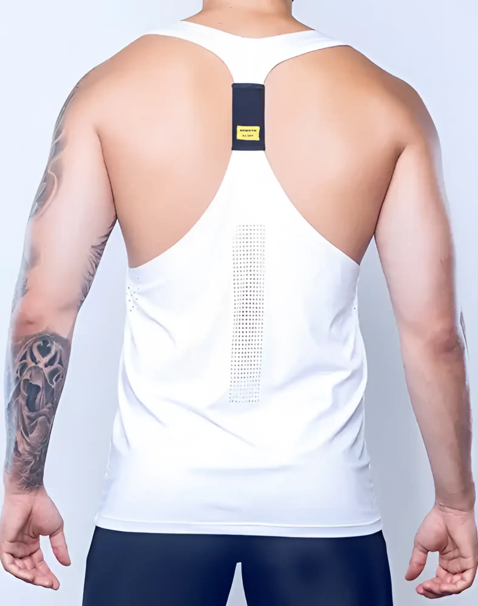 Back view of white spr y-tank athletic tank top with black rectangular panel and vertical mesh design for breathability
