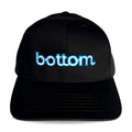 Black Spunky Monkee cap with glowing blue embroidered bottom logo on front panel