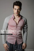 A man wearing a spy henry lau slim fit contrast panel long sleeved shirt in pink and gray panels size L