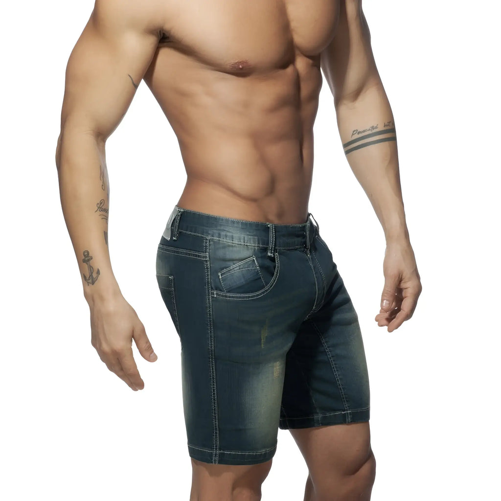 Dark blue denim squat bermuda jeans shorts with faded wash and visible stitching front view