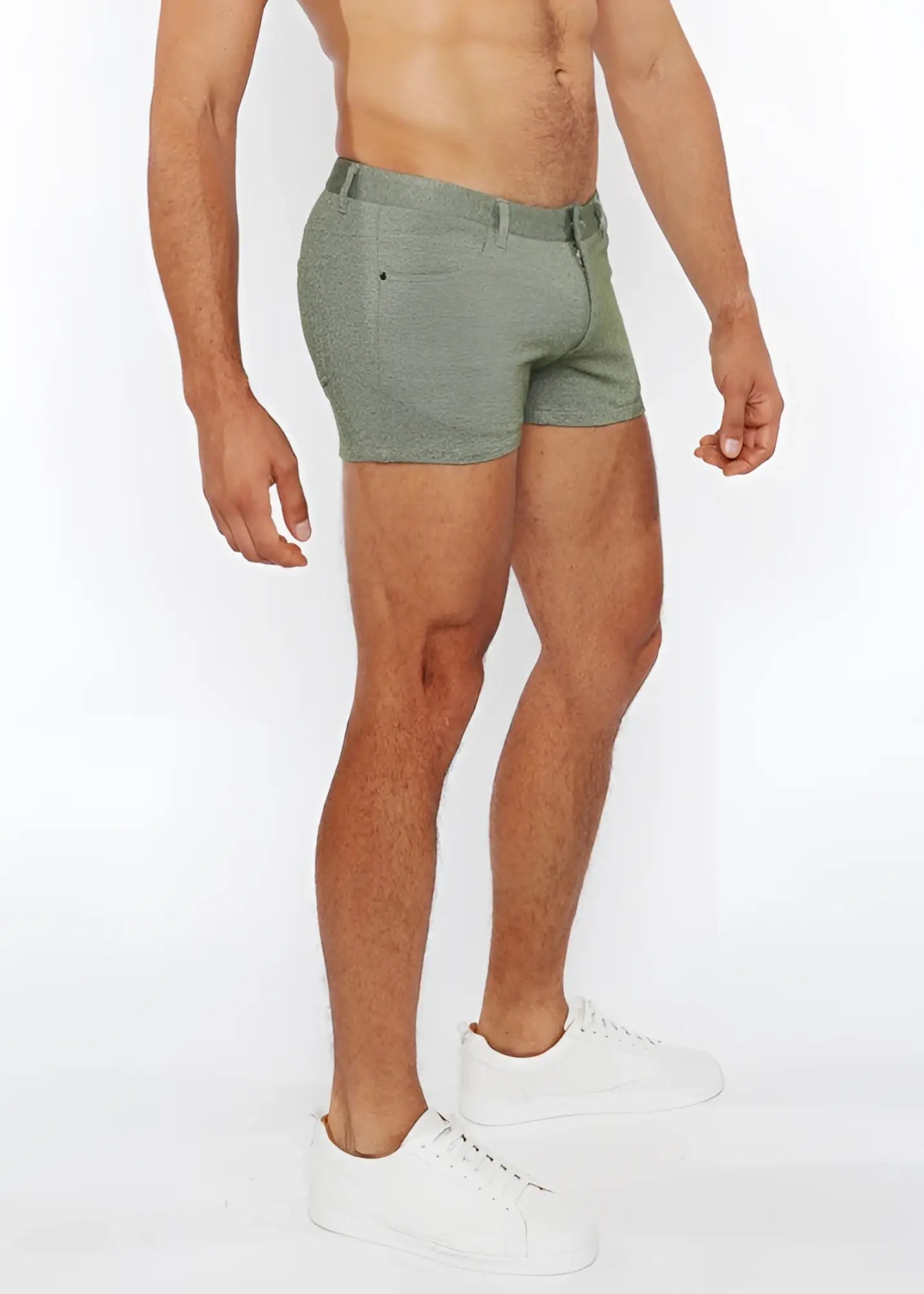 A pair of olive green 3 inch stretch knit two tone shorts with textured fabric belt loop and front pocket