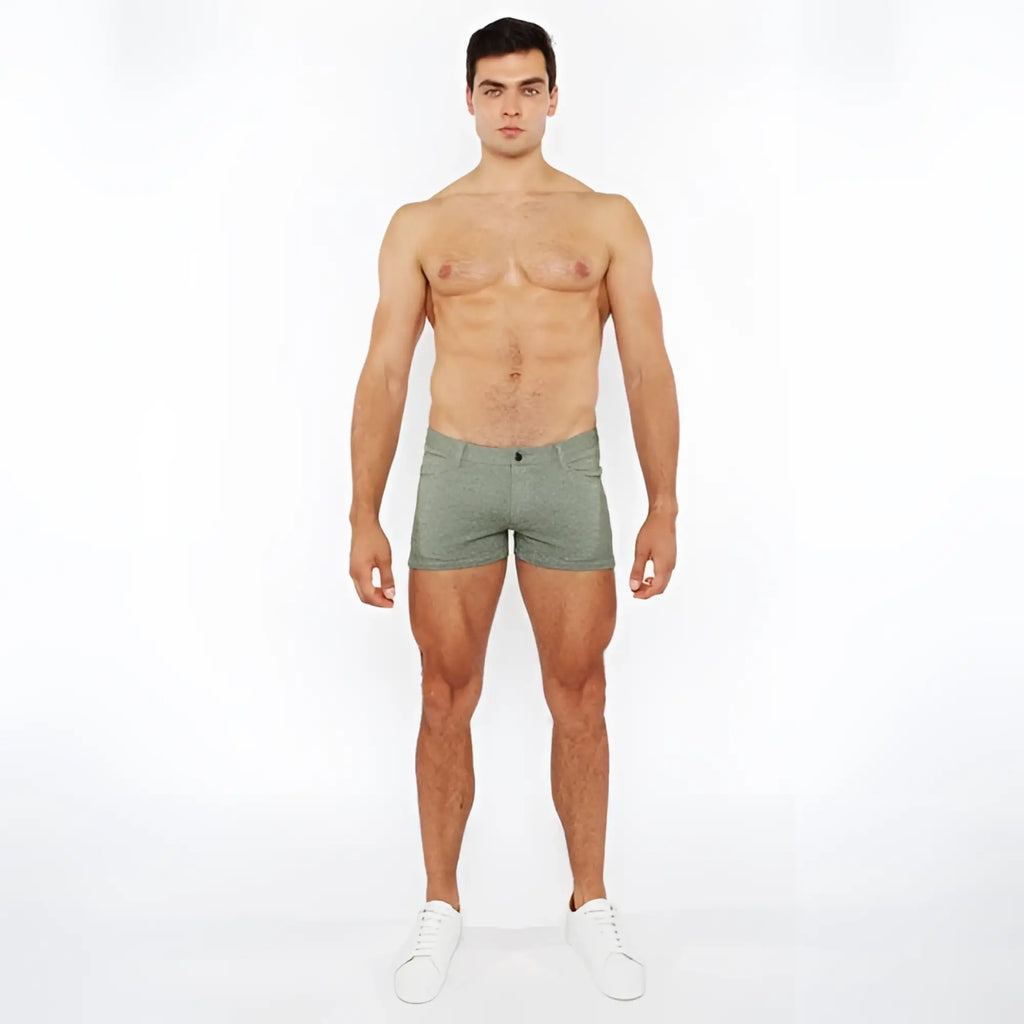 A pair of olive green 3 inch stretch knit two tone briefs with textured fabric and button closure