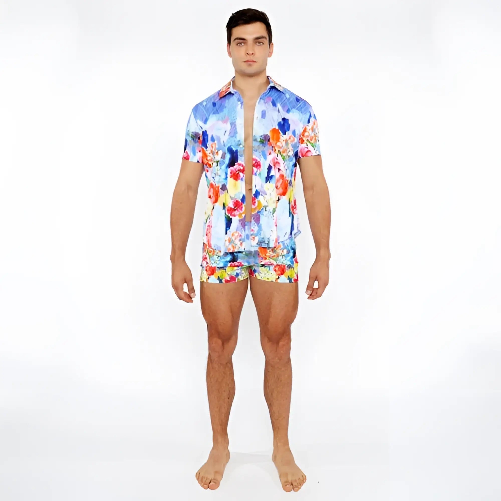 Vibrant blue red and yellow floral abstract printed swim short set featuring a short-sleeved button-up shirt and matching shorts
