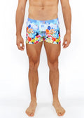 Floral abstract printed swim shorts with vibrant multicolored floral and castle print in blue red yellow and orange