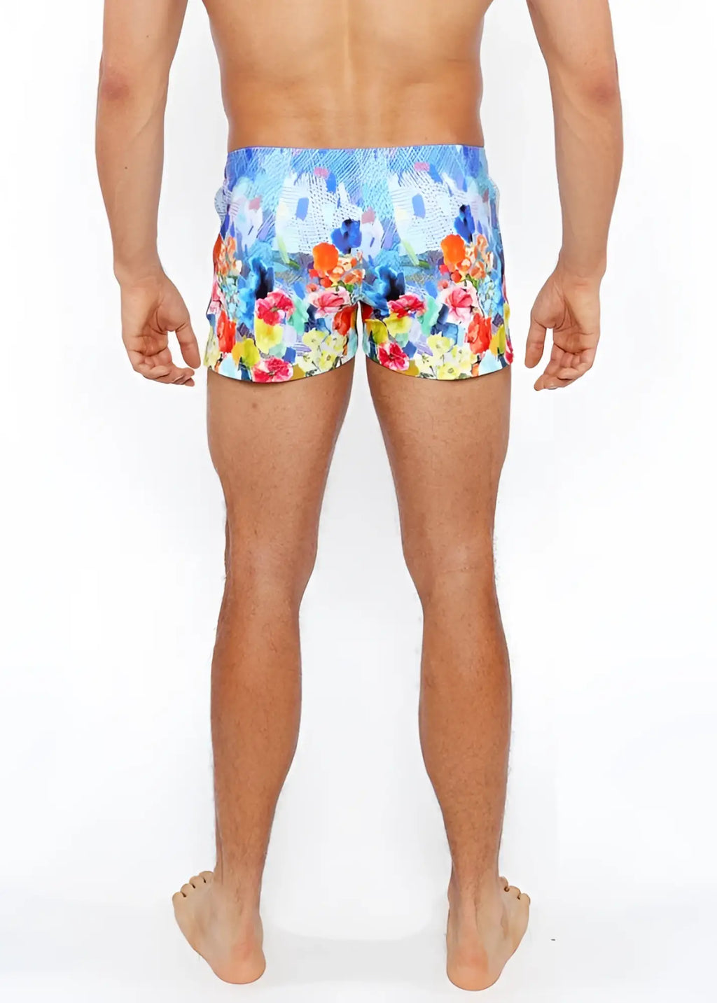 Floral abstract printed swim short featuring vibrant blue orange red and yellow floral pattern for beachwear