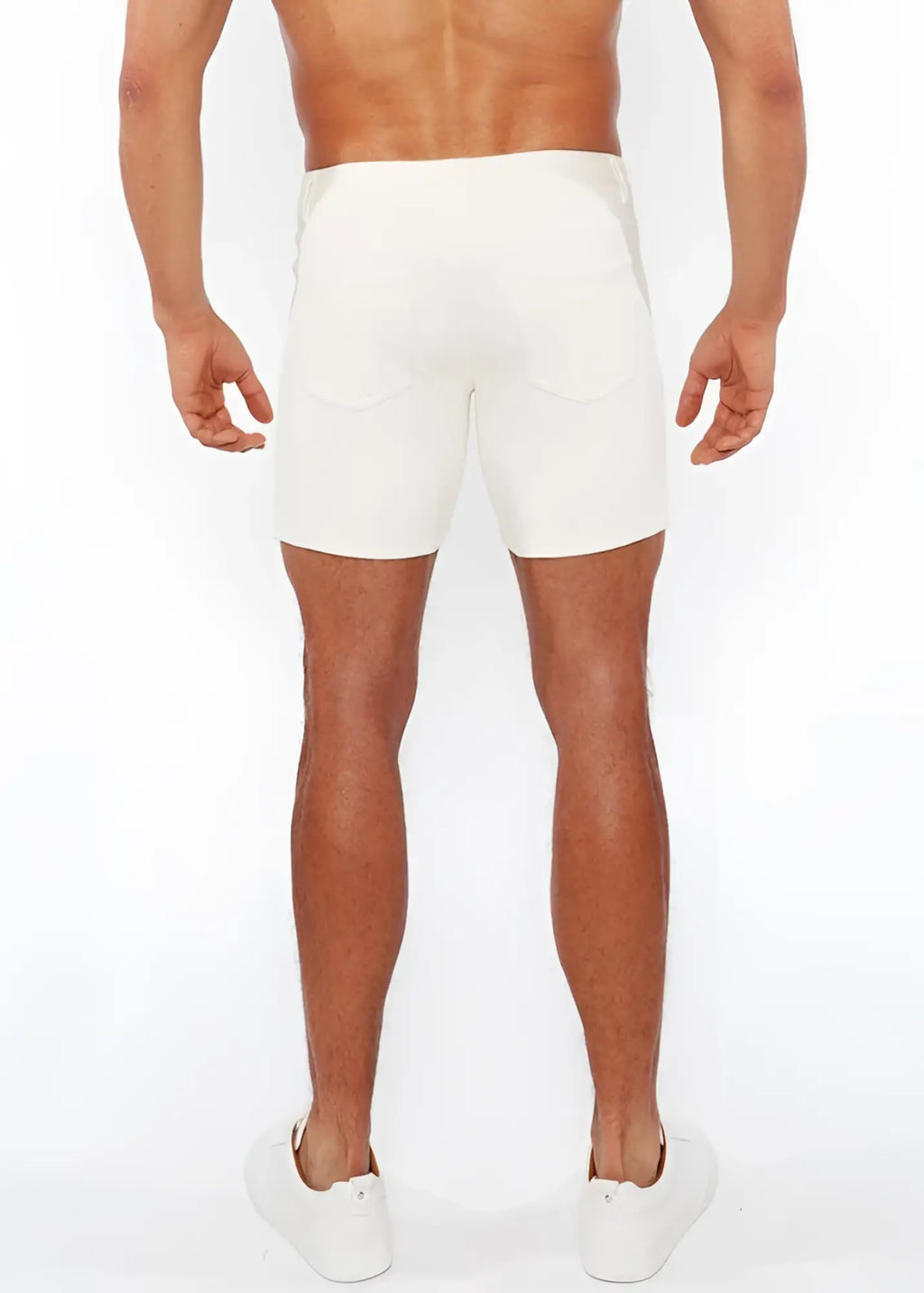 White jacquard stretch knit chino shorts with sleek form-fitting design and subtle stitching details