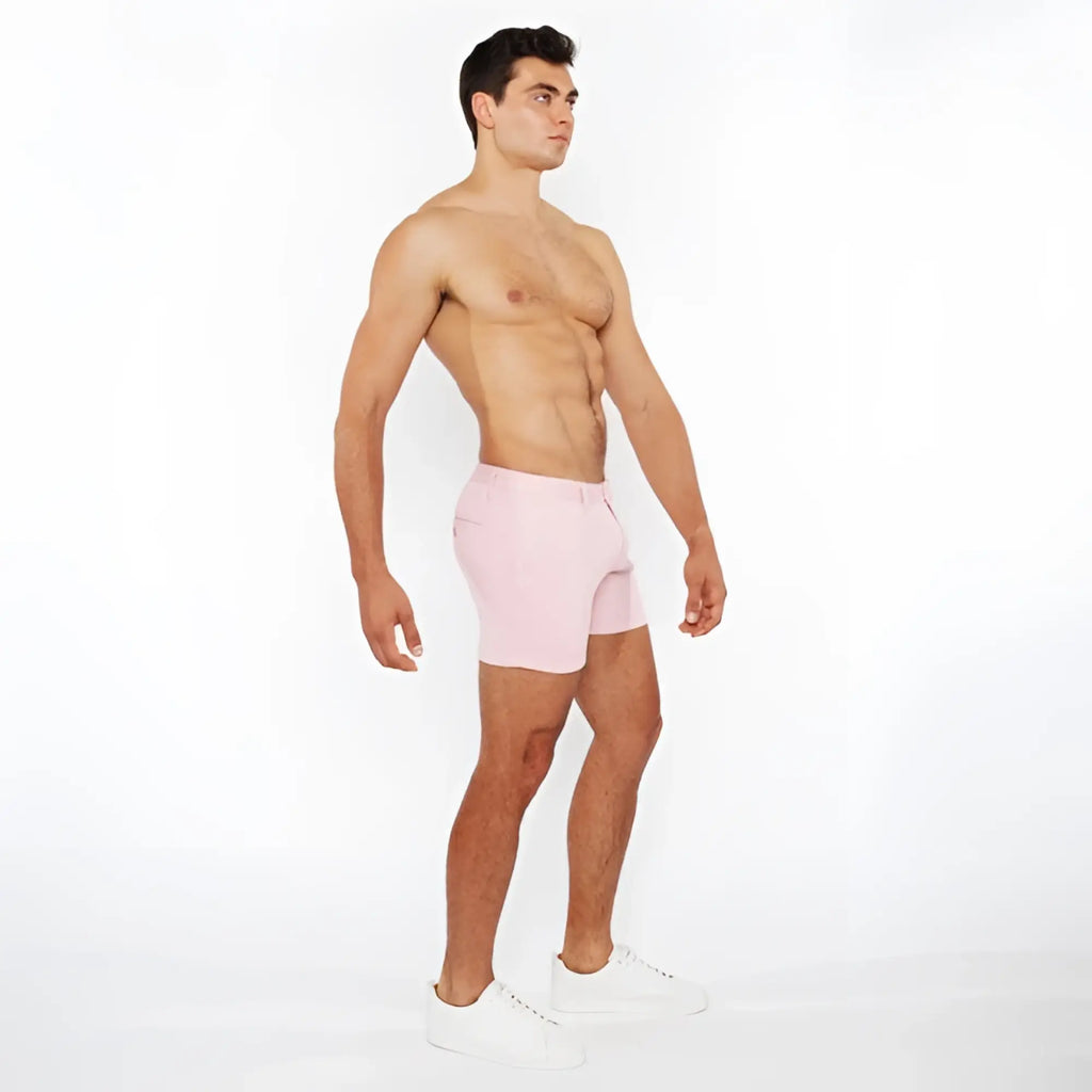 Pink linen-look textured athletic shorts with zip pockets and a clean minimalist design front view