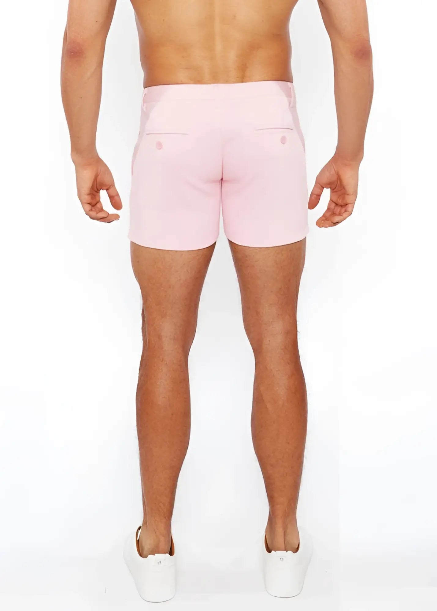 Pink linen-look textured tailored men’s shorts with two back zip pockets shown from the back side