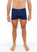 Navy blue pinstripe swim short with white button closure designed for comfortable beach or pool wear
