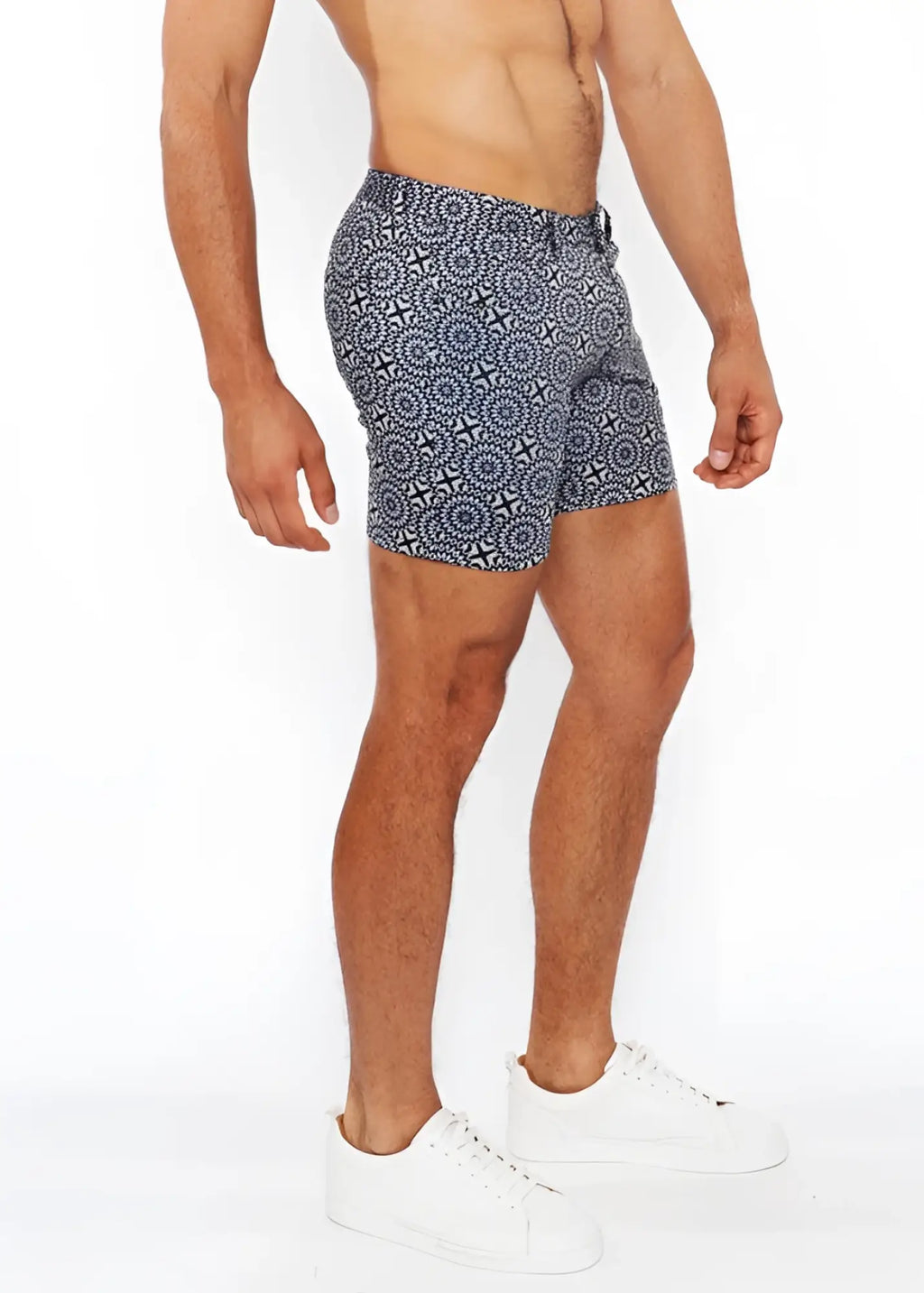 Printed stretch knit short swim trunks in blue and white with a geometric pattern and breathable fabric