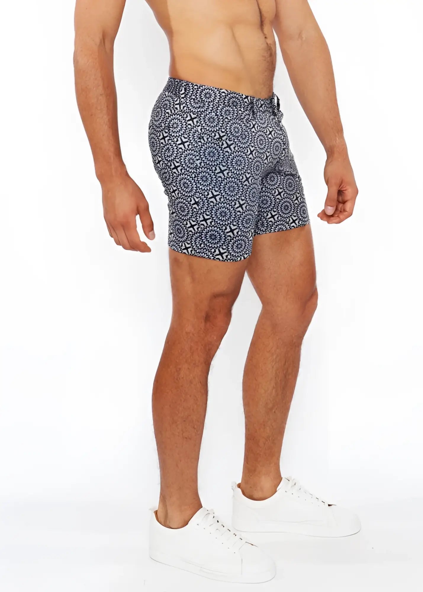Printed stretch knit short swim trunks in blue and white with a geometric pattern and breathable fabric