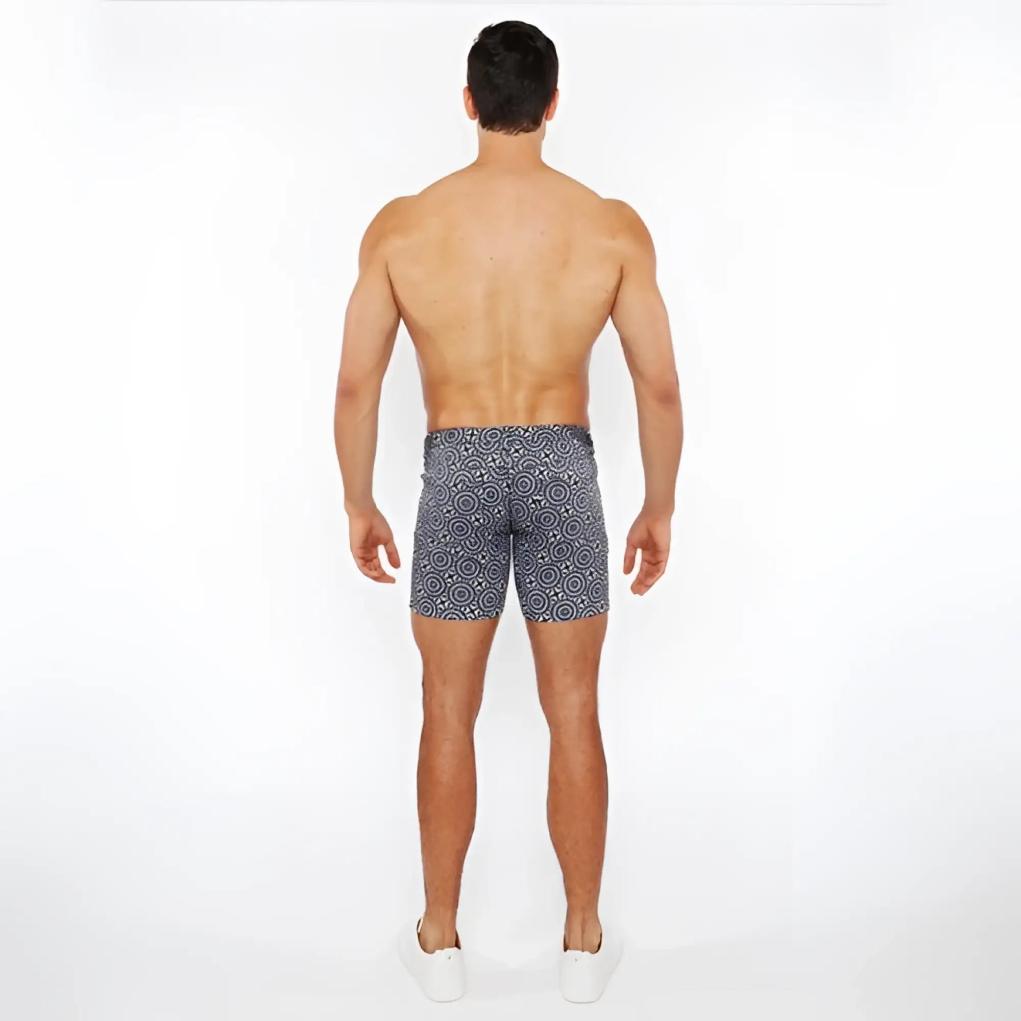 Men’s printed stretch knit short swim trunks in navy blue with white geometric pattern made from stretch fabric