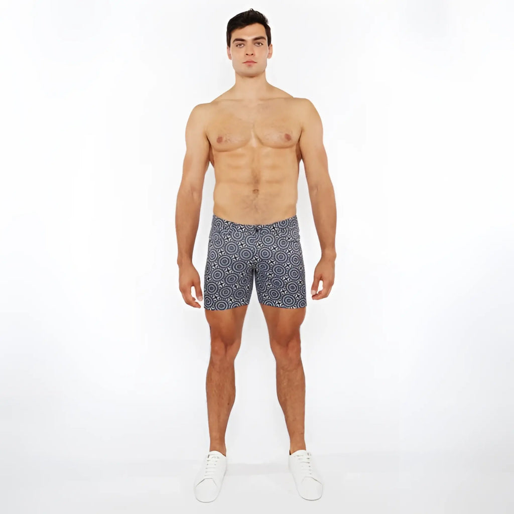 Men’s navy blue printed stretch knit boxer shorts with white circular geometric patterns for comfortable wear