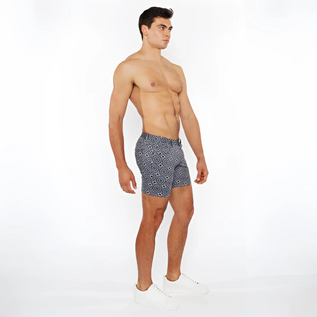 Navy blue printed stretch knit swim trunks with a white geometric pattern for comfortable beachwear