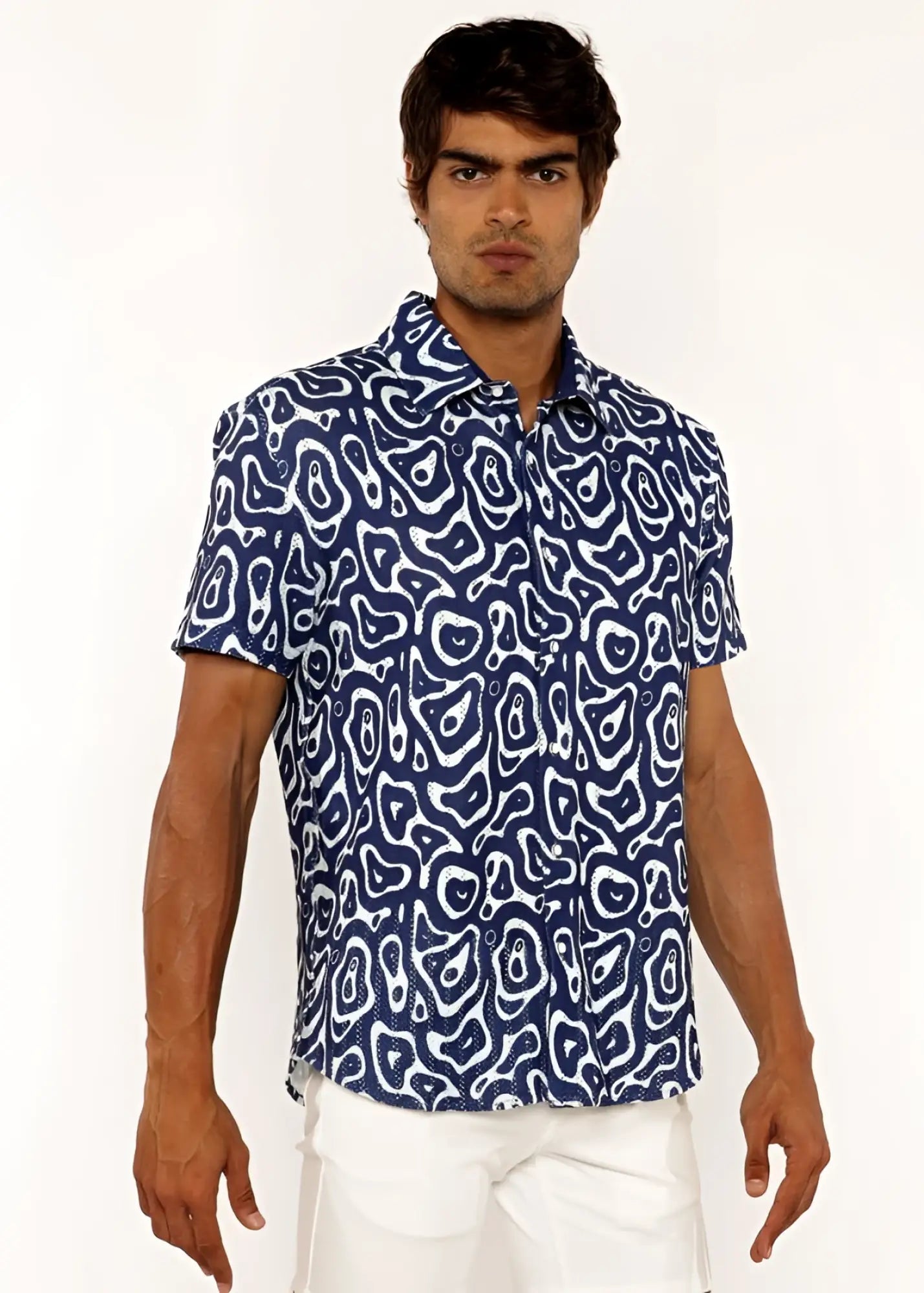 A navy blue short-sleeved squiggly print open knit shirt with white abstract pattern and button-up design