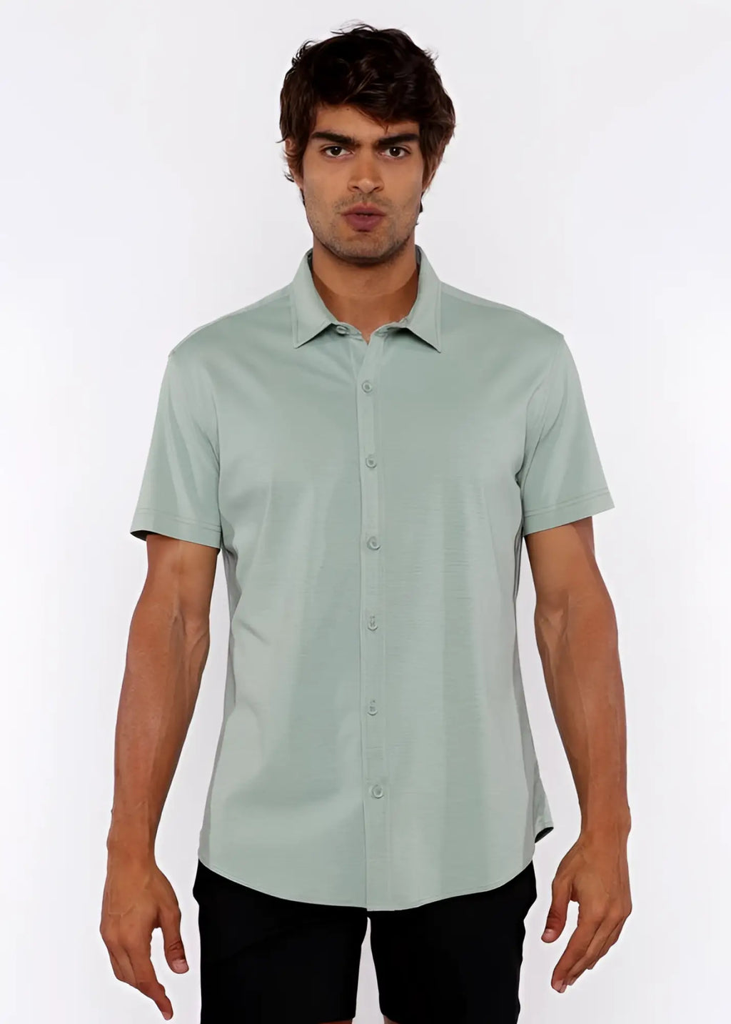 A light green stretch knit shirt with short sleeves classic collar and neatly stitched seams
