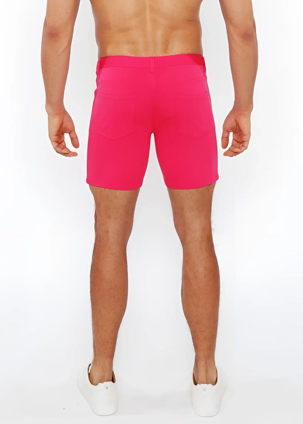 Bright pink stretch knit shorts with fitted waistband and side pockets ideal for athletic use